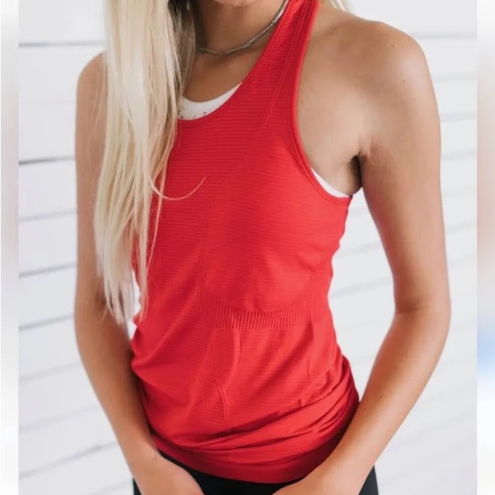 TWO ZYIA seamless tanks, red and aqua